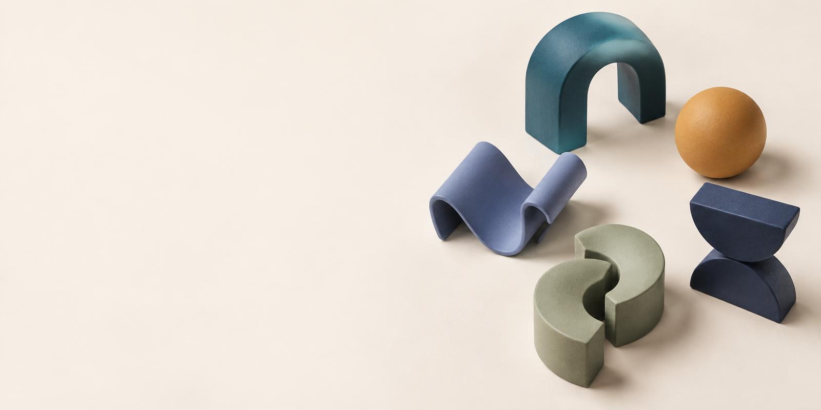 Five sculptural forms in teal, indigo, gold, sage and ink, representing the five human skills pillars